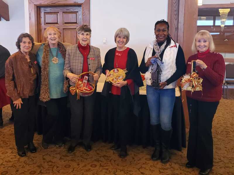 The door prize winners of special baskets made by Virginia Lee.  