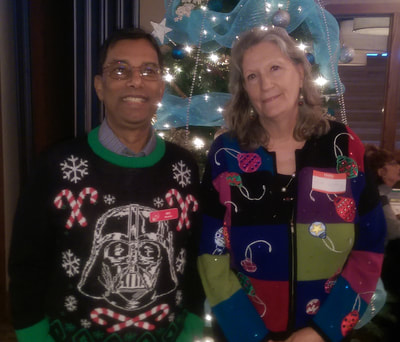 Mo and Vicki dressed in Christmas sweaters