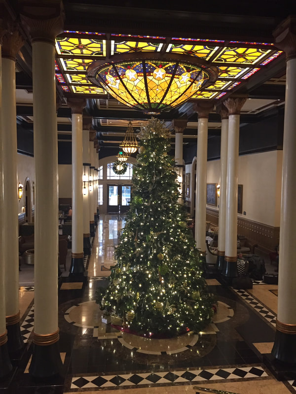 Cook, Taste, Tell with the  Driskill Hotel Christmas decorations. 
